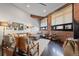 Cozy living room showcasing a sectional sofa, exposed brick, and a variety of decorative elements at 2500 Walnut St # 106, Denver, CO 80205