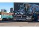 Parking lot featuring Mile High Hibachi food truck with rhino mural in background at 2500 Walnut St # 106, Denver, CO 80205