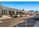 Street view of commercial buildings with various storefronts, showcasing the vibrant urban atmosphere at 2500 Walnut St # 106, Denver, CO 80205