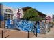 Exterior of a building featuring eye-catching street art, adding to its urban aesthetic and personality at 2500 Walnut St # 106, Denver, CO 80205