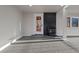A fully remodeled basement includes a modern fireplace and exterior access at 11725 Tomahawk Trl, Conifer, CO 80433