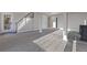 A finished basement boasts a modern staircase and a sleek black fireplace at 11725 Tomahawk Trl, Conifer, CO 80433
