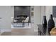 Modern dining room featuring a cozy fireplace and sleek table setting at 11725 Tomahawk Trl, Conifer, CO 80433