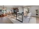 Open-concept dining area leading to a modern kitchen with natural light at 11725 Tomahawk Trl, Conifer, CO 80433