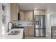Modern kitchen featuring stainless steel appliances and ample counter space at 11725 Tomahawk Trl, Conifer, CO 80433