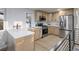 Modern kitchen with stainless steel appliances and ample counter space at 11725 Tomahawk Trl, Conifer, CO 80433