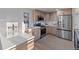 Modern kitchen with stainless steel appliances and ample counter space at 11725 Tomahawk Trl, Conifer, CO 80433