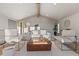 Bright living room featuring a beamed ceiling, neutral color palette, and lots of natural light at 11725 Tomahawk Trl, Conifer, CO 80433