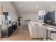 A living room features a wood-burning stove and a neutral color palette at 11725 Tomahawk Trl, Conifer, CO 80433