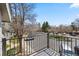 A view from the apartment balcony shows a parking lot surrounded by trees and other buildings at 4086 S Carson St # F, Aurora, CO 80014