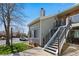Charming condominium exterior with well-maintained landscaping and a private entrance with stairway at 4086 S Carson St # F, Aurora, CO 80014