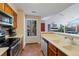 Functional kitchen with stainless steel appliances, solid surface counters, and tile backsplash at 4086 S Carson St # F, Aurora, CO 80014