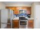 Well-equipped kitchen with stainless steel appliances, ample cabinet space, and stylish backsplash at 4086 S Carson St # F, Aurora, CO 80014