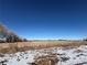 Farmland landscape with snow and clear sky at 8003 N 95Th St, Longmont, CO 80504