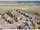 Aerial view of a residential neighborhood highlighting the lush landscaping, sidewalks and cul-de-sac streets at 7869 Solstice Way, Castle Rock, CO 80108