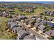Expansive aerial view of a suburban neighborhood featuring well-maintained homes and green spaces at 7869 Solstice Way, Castle Rock, CO 80108