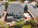 Aerial view showcasing the home's backyard with a patio, deck, landscaping, and outdoor basketball court at 7869 Solstice Way, Castle Rock, CO 80108