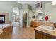 Large bathroom featuring a fireplace and access to the en-suite bedroom and walk-in closet at 7869 Solstice Way, Castle Rock, CO 80108