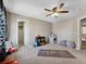 Comfortable bedroom with carpet, ceiling fan, and walk-in closet at 7869 Solstice Way, Castle Rock, CO 80108