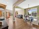 Bright dining area featuring hardwood floors, natural light, and elegant archways at 7869 Solstice Way, Castle Rock, CO 80108
