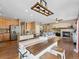 Spacious kitchen featuring wooden cabinets, stainless steel appliances, and an adjacent living room at 7869 Solstice Way, Castle Rock, CO 80108
