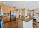 Well-lit kitchen with wooden cabinets, stainless steel appliances, and granite countertops at 7869 Solstice Way, Castle Rock, CO 80108