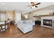 Inviting living space with a cozy fireplace, comfortable seating, and hardwood floors at 7869 Solstice Way, Castle Rock, CO 80108