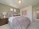 Inviting bedroom with a cozy bed, stylish bedside table, and modern decor accents at 10366 Uvalda Ct, Commerce City, CO 80022
