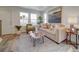 Relaxing living room boasts natural light, comfortable seating, stylish decor, and is perfect for entertaining at 10366 Uvalda Ct, Commerce City, CO 80022