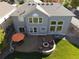 Aerial view of the house showing backyard with patio and built-in fire pit at 23029 Cleveland Dr, Parker, CO 80138