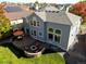 Aerial view of home, patio, and fire pit in a well-maintained backyard at 23029 Cleveland Dr, Parker, CO 80138