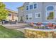 Beautiful home exterior with a spacious patio, fire pit, and ample seating for entertaining at 23029 Cleveland Dr, Parker, CO 80138
