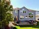Beautiful backyard featuring a stone fire pit, patio, and well-maintained lawn at 23029 Cleveland Dr, Parker, CO 80138