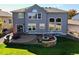 Expansive backyard with a stone fire pit and patio, great for entertaining at 23029 Cleveland Dr, Parker, CO 80138