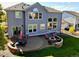 Aerial view highlighting the home's patio and outdoor firepit area at 23029 Cleveland Dr, Parker, CO 80138