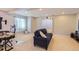 Finished basement area with plush carpet, comfortable seating, and a modern desk at 23029 Cleveland Dr, Parker, CO 80138