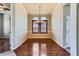 Elegant dining room featuring hardwood floors, wainscoting, and a stylish chandelier at 23029 Cleveland Dr, Parker, CO 80138