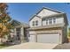 Charming two-story home featuring a stone-accented facade, spacious driveway and inviting front porch at 23029 Cleveland Dr, Parker, CO 80138