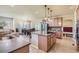 Bright kitchen featuring a center island with cooktop, stainless steel appliances, and breakfast nook at 23029 Cleveland Dr, Parker, CO 80138