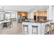 An open kitchen features granite countertops, stainless steel appliances, and bar seating at 23029 Cleveland Dr, Parker, CO 80138