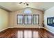 Large living room featuring a fireplace and vaulted ceilings and hardwood floors at 23029 Cleveland Dr, Parker, CO 80138