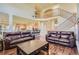 Spacious living area featuring an open floor plan, hardwood floors, and a staircase at 23029 Cleveland Dr, Parker, CO 80138