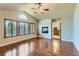 Open-concept living room featuring a fireplace and hardwood floors at 23029 Cleveland Dr, Parker, CO 80138