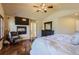 Comfortable main bedroom boasts hardwood floors, vaulted ceilings, fireplace, and a relaxing ambiance at 23029 Cleveland Dr, Parker, CO 80138