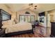 Main bedroom features fireplace, vaulted ceilings, wood floors, and lots of natural light at 23029 Cleveland Dr, Parker, CO 80138
