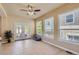 Bright sunroom features tile floors, windows, and access to the outdoor patio at 23029 Cleveland Dr, Parker, CO 80138