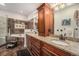 Luxurious bathroom with double sinks, granite countertops, and elegant cabinetry, spa-like retreat at 7522 S Mount Zirkel, Littleton, CO 80127