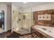 Modern bathroom with glass shower, soaking tub, and tasteful tile accents, creating a relaxing oasis at 7522 S Mount Zirkel, Littleton, CO 80127