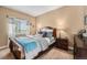 Comfortable bedroom with soft lighting and a window view at 7522 S Mount Zirkel, Littleton, CO 80127