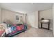 Neutral bedroom with a view to the outside, simple decor, and a built-in closet at 7522 S Mount Zirkel, Littleton, CO 80127